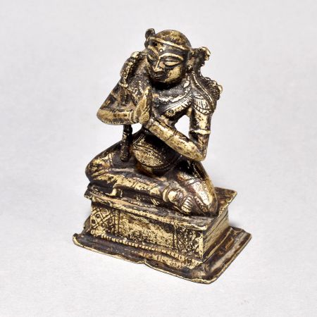 Male God Figure Sitting with Axe